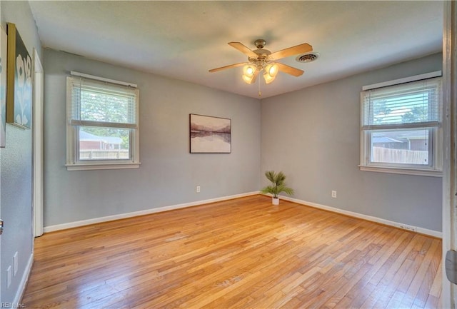 529 Warren Ave, Chesapeake, VA 23322 - spare room featuring light wood-style flooring, plenty of natural light, a ceiling fan, and baseboards