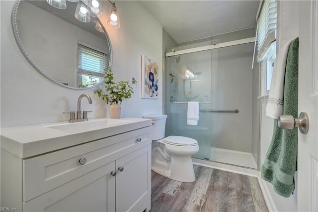529 Warren Ave, Chesapeake, VA 23322 - full bathroom with wood finished floors, vanity, a shower stall, and toilet