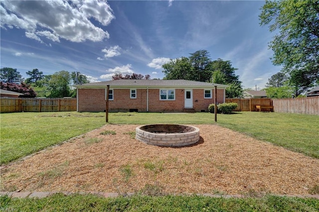 529 Warren Ave, Chesapeake, VA 23322 - back of house with brick siding and a fire pit