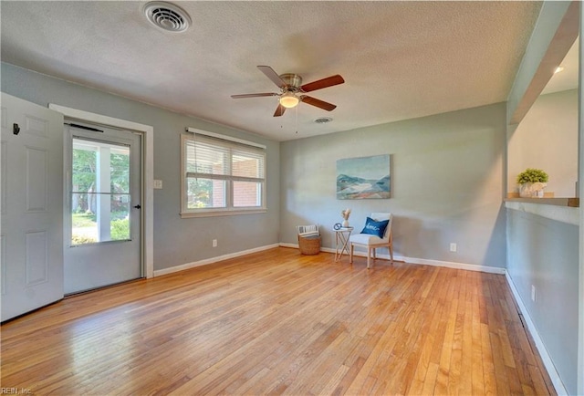 529 Warren Ave, Chesapeake, VA 23322 - unfurnished room with hardwood / wood-style floors, a textured ceiling, a ceiling fan, and baseboards