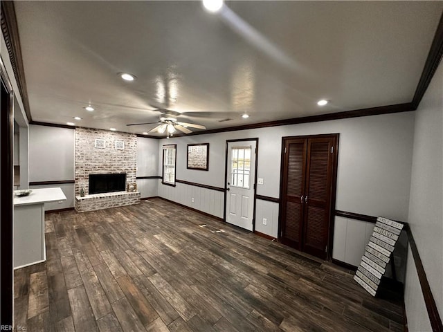 1013 River Birch Ct, Chesapeake, VA 23320 - unfurnished living room featuring ornamental molding, a fireplace, ceiling fan, recessed lighting, and dark wood-style floors