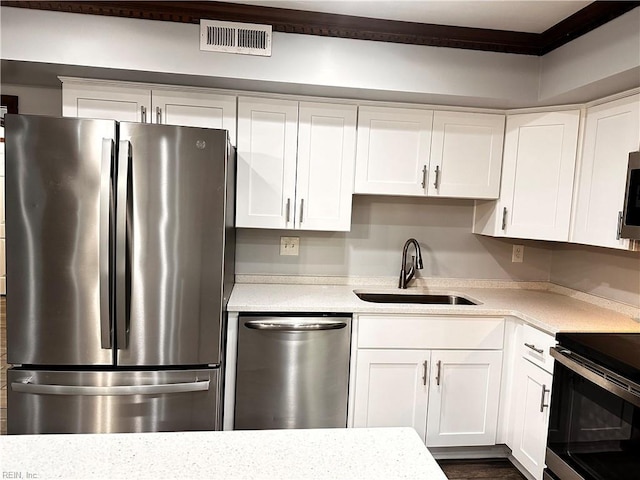 1013 River Birch Ct, Chesapeake, VA 23320 - kitchen featuring stainless steel appliances, a sink, and white cabinets