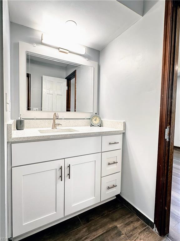 1013 River Birch Ct, Chesapeake, VA 23320 - bathroom with vanity, wood finished floors, and baseboards