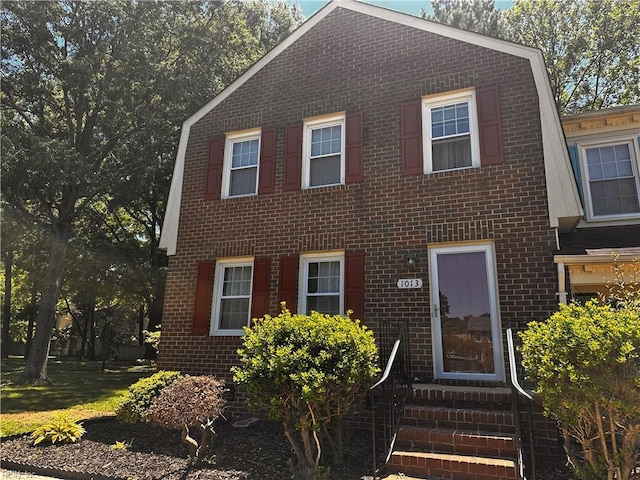 1013 River Birch Ct, Chesapeake, VA 23320 - view of front of home featuring a gambrel roof, brick siding, and entry steps