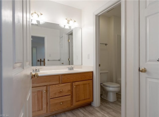 3711 Goodwin Neck Rd, Yorktown, VA 23692 - full bath with double vanity, toilet, and wood finished floors
