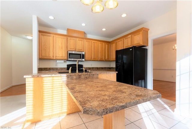 3711 Goodwin Neck Rd, Yorktown, VA 23692 - kitchen with black appliances, a chandelier, light tile patterned flooring, recessed lighting, and a center island