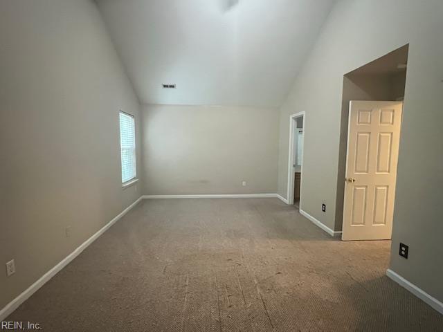 111 Chardonnay Rd, Williamsburg, VA 23185 - unfurnished bedroom featuring carpet, baseboards, and high vaulted ceiling