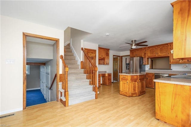 1364 Sir Richard Rd, Virginia Beach, VA 23455 - kitchen featuring appliances with stainless steel finishes, light wood-style flooring, light countertops, and ceiling fan