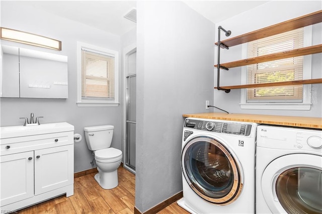 1364 Sir Richard Rd, Virginia Beach, VA 23455 - laundry room with washer and dryer, light wood-style floors, plenty of natural light, and baseboards