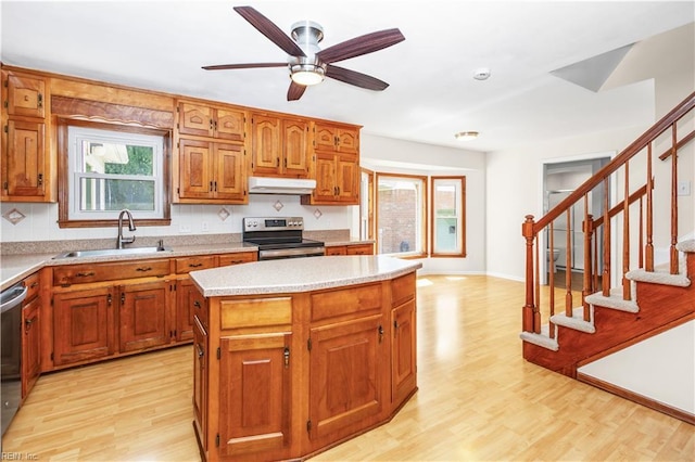1364 Sir Richard Rd, Virginia Beach, VA 23455 - kitchen featuring appliances with stainless steel finishes, under cabinet range hood, a sink, and light wood finished floors