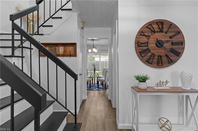 1801 Delaney St, Virginia Beach, VA 23464 - staircase with wood finished floors and a chandelier