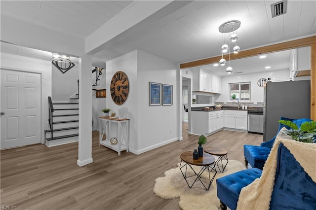 1801 Delaney St, Virginia Beach, VA 23464 - living area with light wood-style floors, stairway, and wood ceiling