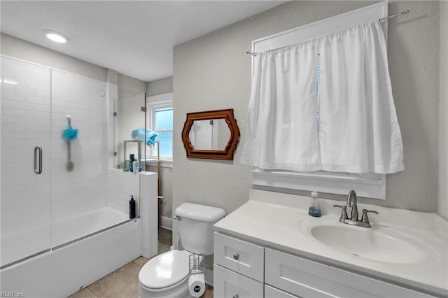 1424 Stewart St, Chesapeake, VA 23324 - full bath featuring toilet, vanity, combined bath / shower with glass door, tile patterned flooring, and a textured wall
