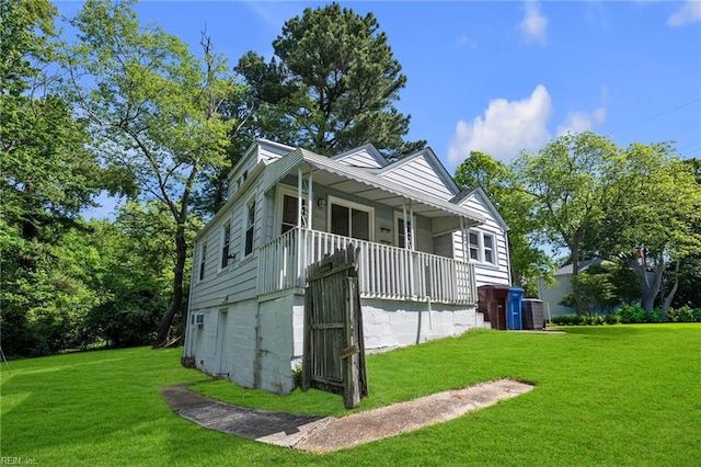 1424 Stewart St, Chesapeake, VA 23324 - view of front of home with covered porch and a front yard