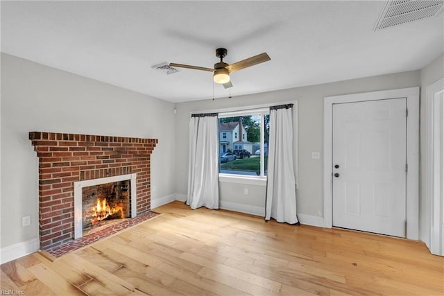 1424 Stewart St, Chesapeake, VA 23324 - unfurnished living room featuring a fireplace, ceiling fan, light wood finished floors, and baseboards