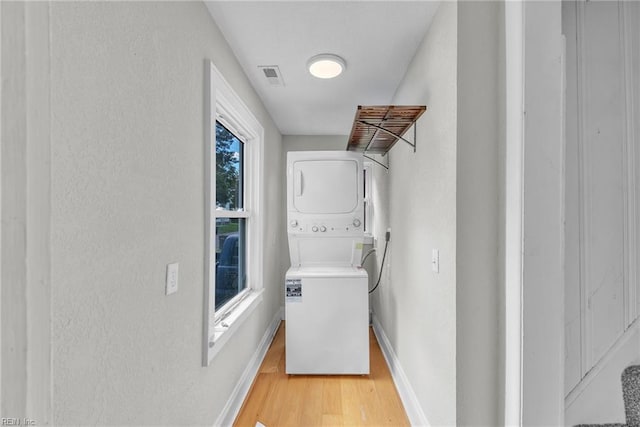1424 Stewart St, Chesapeake, VA 23324 - washroom featuring stacked washer / dryer, light wood-type flooring, and baseboards