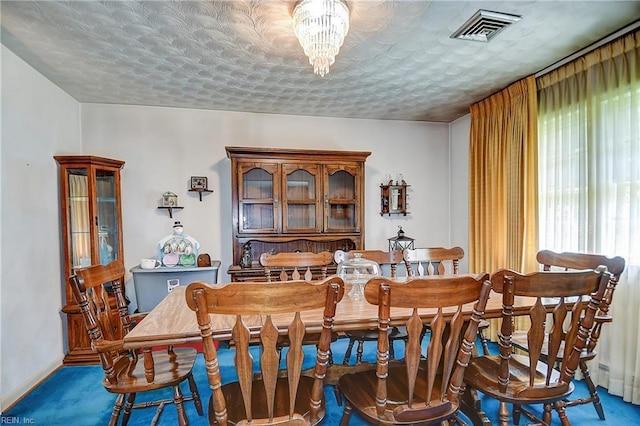 409 Briarfield Dr, Chesapeake, VA 23322 - dining area featuring carpet floors, a textured ceiling, baseboards, and a chandelier