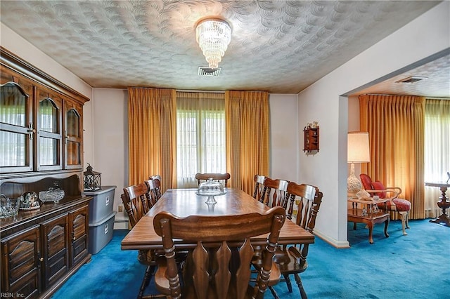 409 Briarfield Dr, Chesapeake, VA 23322 - dining room with carpet floors, healthy amount of natural light, a baseboard radiator, and a textured ceiling