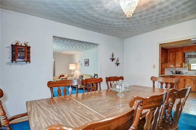 409 Briarfield Dr, Chesapeake, VA 23322 - dining space featuring a textured ceiling and a chandelier