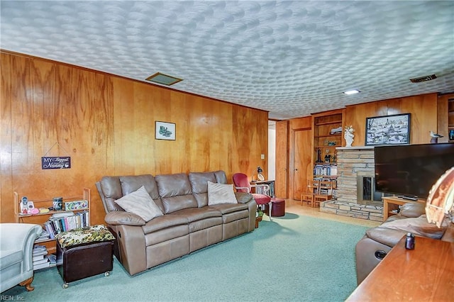 409 Briarfield Dr, Chesapeake, VA 23322 - living area with wood walls, carpet floors, and a stone fireplace