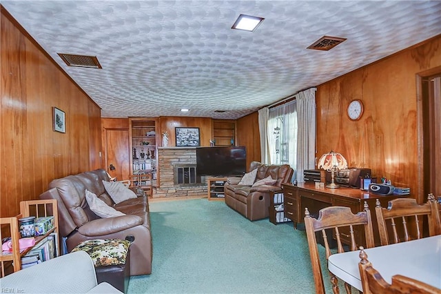 409 Briarfield Dr, Chesapeake, VA 23322 - carpeted living area with wood walls and a stone fireplace