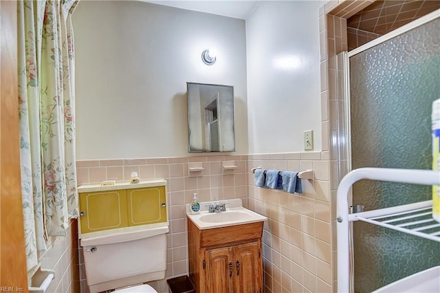 409 Briarfield Dr, Chesapeake, VA 23322 - full bathroom featuring tile walls, toilet, vanity, a shower with door, and wainscoting