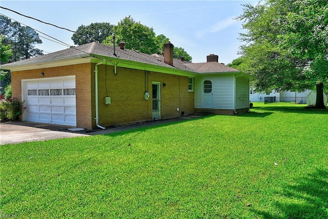 409 Briarfield Dr, Chesapeake, VA 23322 - back of property featuring a chimney, a garage, a yard, driveway, and brick siding