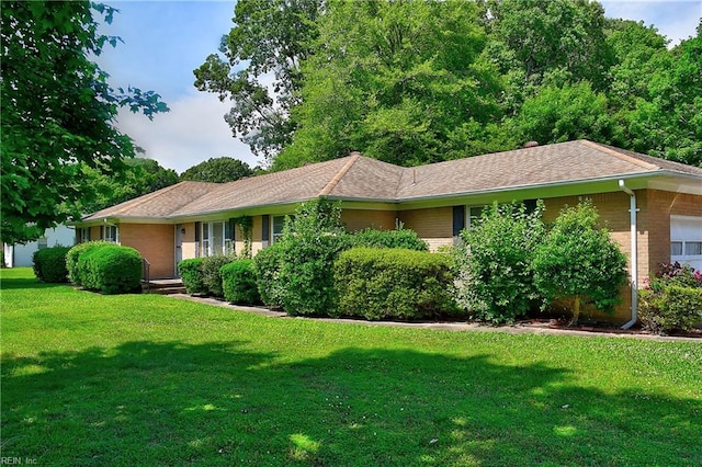 409 Briarfield Dr, Chesapeake, VA 23322 - single story home featuring brick siding, a front yard, and an attached garage
