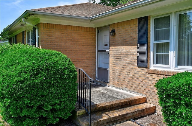 409 Briarfield Dr, Chesapeake, VA 23322 - doorway to property featuring brick siding and a shingled roof