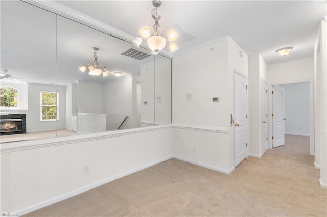 2819 Rose Garden Way, Virginia Beach, VA 23456 - spare room featuring a chandelier, light colored carpet, baseboards, a fireplace, and ceiling fan