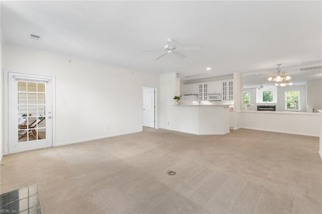2819 Rose Garden Way, Virginia Beach, VA 23456 - unfurnished living room featuring a ceiling fan, light colored carpet, a chandelier, baseboards, and recessed lighting