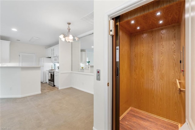 2819 Rose Garden Way, Virginia Beach, VA 23456 - hallway with elevator, baseboards, a chandelier, light carpet, and recessed lighting