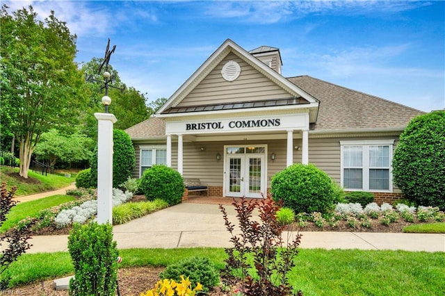 303 Settlement Dr Unit 303, Williamsburg, VA 23188 - view of front of home with french doors, brick siding, and a shingled roof