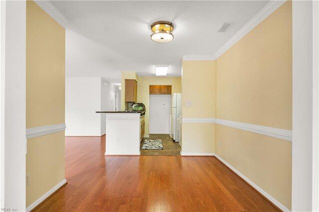 303 Settlement Dr Unit 303, Williamsburg, VA 23188 - foyer entrance featuring wood finished floors, baseboards, and ornamental molding