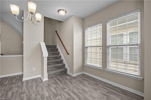 249 Carnelian St Unit 85A, Virginia Beach, VA 23462 - stairs featuring wood finished floors, a chandelier, and baseboards