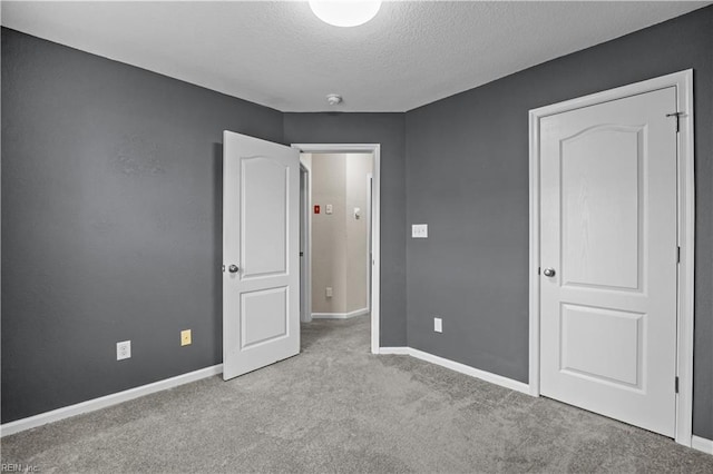 249 Carnelian St Unit 85A, Virginia Beach, VA 23462 - unfurnished bedroom featuring a textured ceiling, carpet, and baseboards