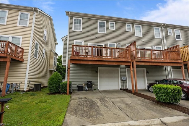 249 Carnelian St Unit 85A, Virginia Beach, VA 23462 - back of house featuring a garage, driveway, and a yard