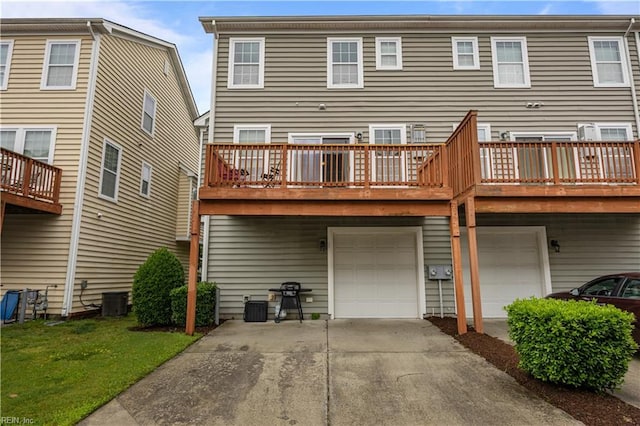 249 Carnelian St Unit 85A, Virginia Beach, VA 23462 - rear view of house with a garage, driveway, a yard, and central AC unit