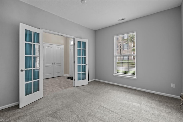 249 Carnelian St Unit 85A, Virginia Beach, VA 23462 - empty room featuring french doors, carpet, and baseboards