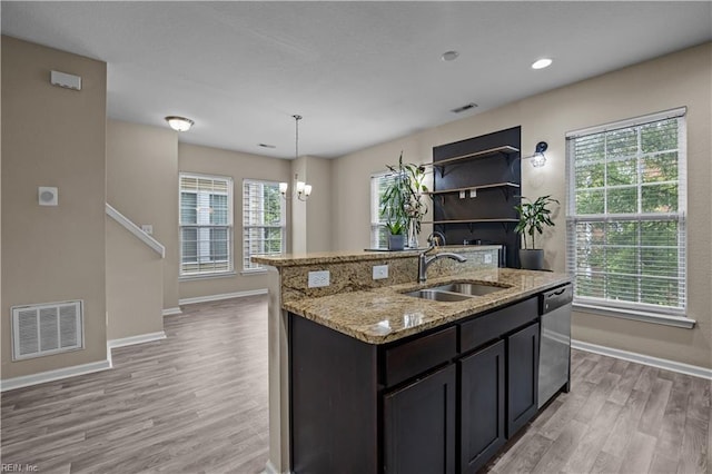 249 Carnelian St Unit 85A, Virginia Beach, VA 23462 - kitchen featuring a sink, stainless steel dishwasher, light wood-style flooring, baseboards, and a kitchen island with sink