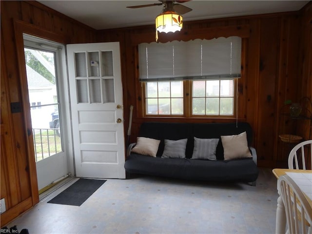 101 Lumar Rd, Smithfield, VA 23430 - living room featuring wood walls, ceiling fan, healthy amount of natural light, and tile patterned floors