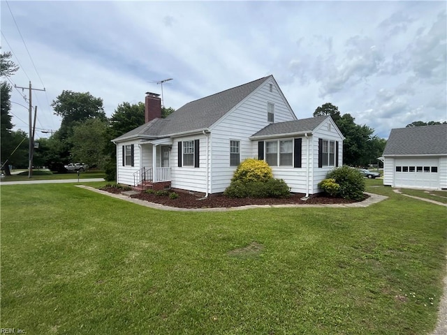 101 Lumar Rd, Smithfield, VA 23430 - view of front of home featuring a chimney, a front yard, a shingled roof, and a garage