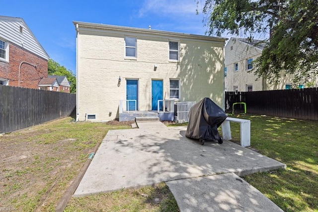 127 Clyde St, Hampton, VA 23669 - rear view of property with a patio area and brick siding