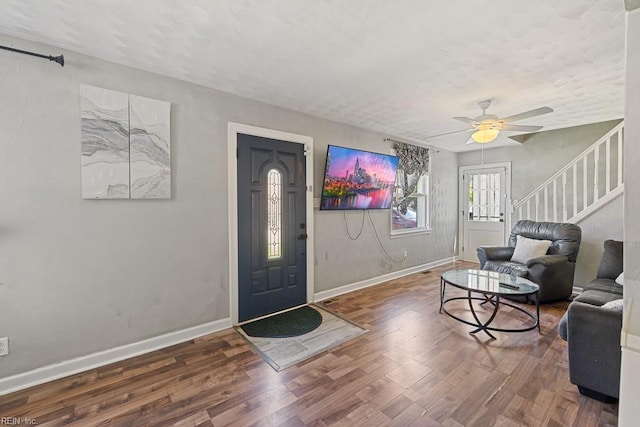 127 Clyde St, Hampton, VA 23669 - entrance foyer with stairs, wood finished floors, a ceiling fan, and baseboards