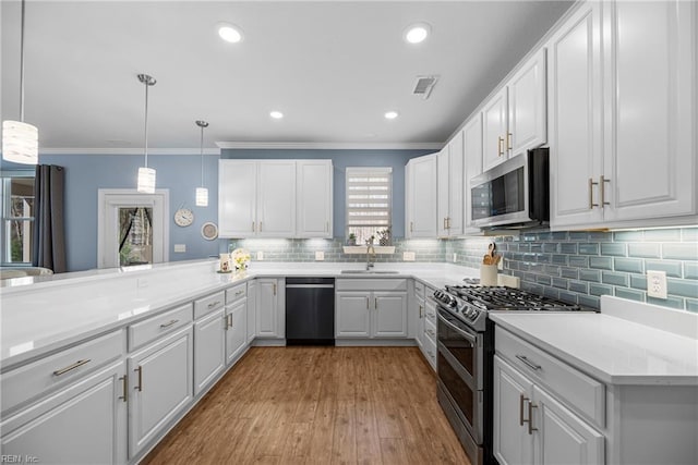 531 Middleton Way, Chesapeake, VA 23322 - kitchen featuring stainless steel appliances, crown molding, white cabinetry, backsplash, and light wood finished floors