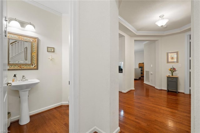 313 Preservation Reach Reach, Chesapeake, VA 23320 - corridor featuring wood finished floors, ornamental molding, baseboards, and a sink