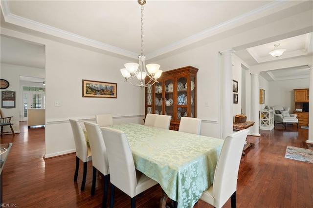 313 Preservation Reach Reach, Chesapeake, VA 23320 - dining room with dark wood-style flooring, decorative columns, crown molding, a chandelier, and a tray ceiling