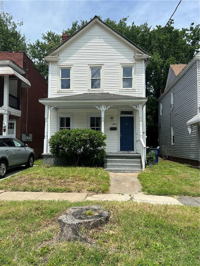 834 W 41st St, Norfolk, VA 23508 - view of front of home featuring covered porch, a front yard, and a chimney