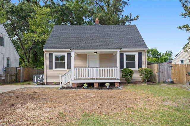 31 W Sunset Rd, Hampton, VA 23669 - bungalow with a gate, a porch, a shingled roof, a chimney, and central AC unit