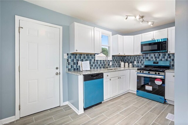 31 W Sunset Rd, Hampton, VA 23669 - kitchen featuring dishwashing machine, stainless steel range with gas stovetop, decorative backsplash, and wood finish floors